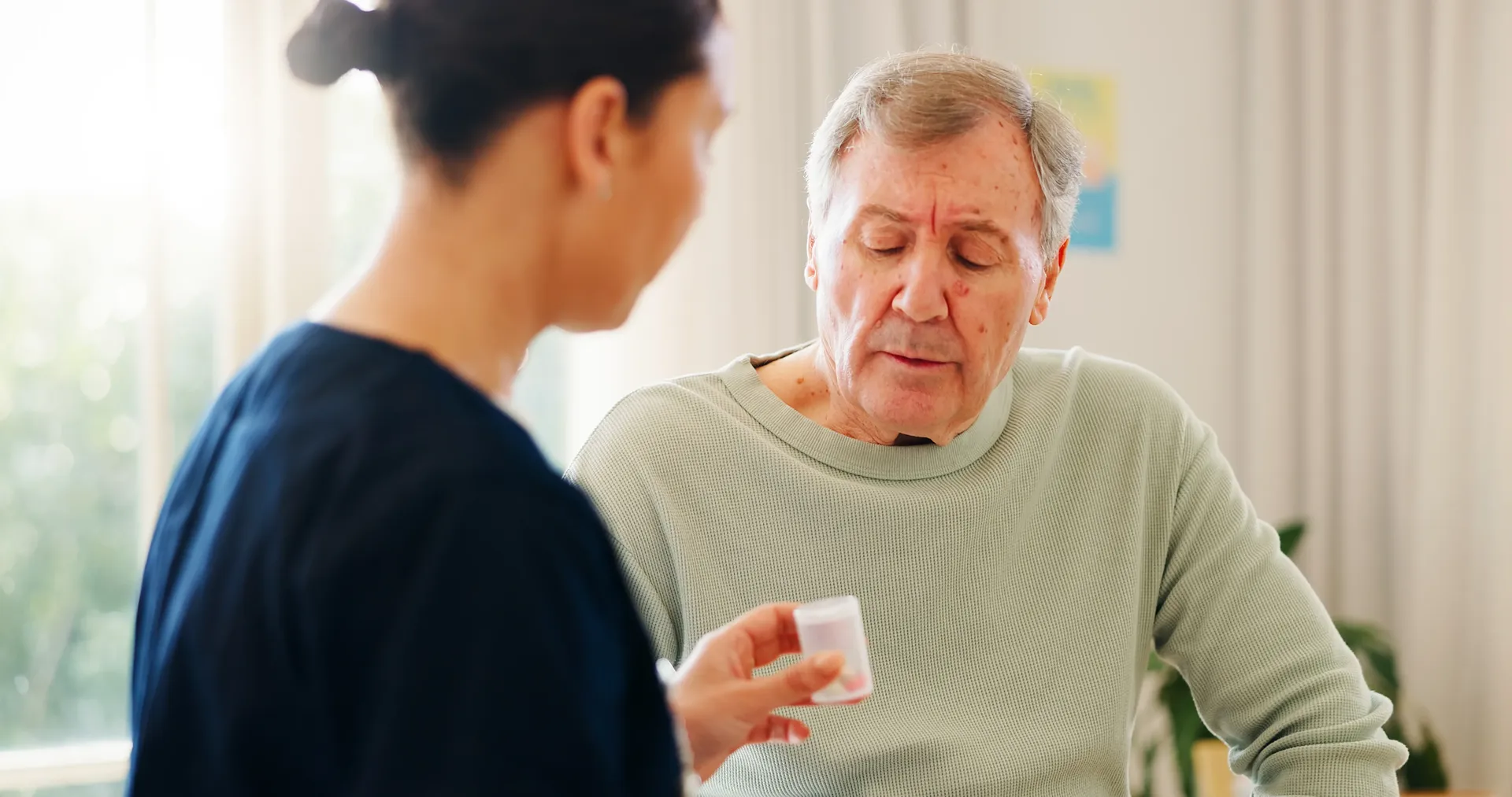 Caregivers sharing a joyful moment with elderly clients